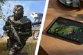 A solider from Warzone Mobile in black and green armour on one side of a diagonal white line. On the other, a black Google tablet with a green, black and red wing on the display.