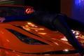 Yakuza character laying on top of a car